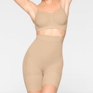 NWT SKIMS high waisted mid thigh shorts - size small, shade sand